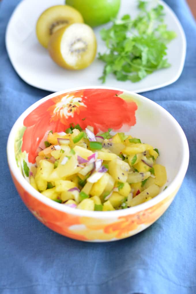 Kiwi Pineapple Fruit Salsa in a flowered bowl.