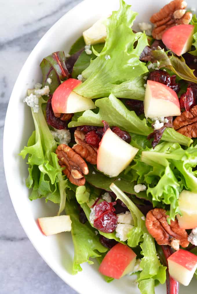 Harvest Salad with Apple Dijon Dressing is filled with the most delicious flavors of Fall. Perfect for Thanksgiving, Christmas, and any holiday party.
