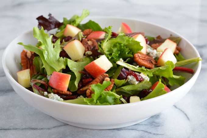 Harvest Salad with Apple Dijon Dressing is filled with the most delicious flavors of Fall. Perfect for Thanksgiving, Christmas, and any holiday party.