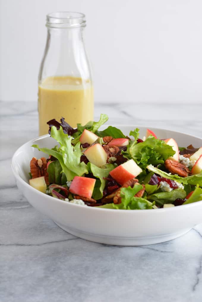 Harvest Salad with Apple Dijon Dressing is filled with the most delicious flavors of Fall. Perfect for Thanksgiving, Christmas, and any holiday party.