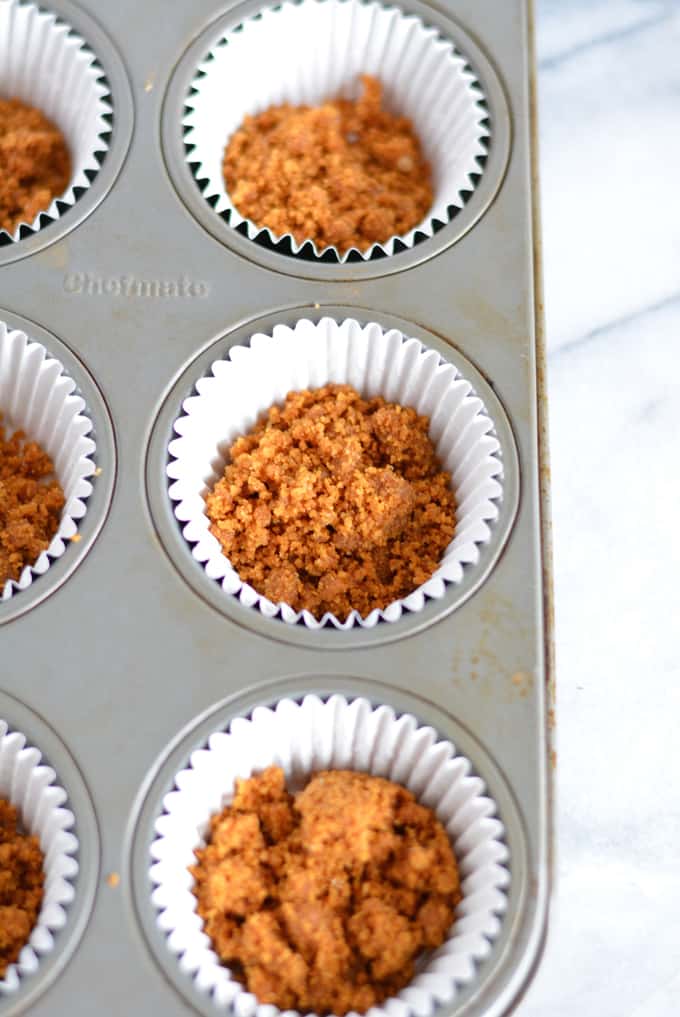 Mini Lower Sugar Cheesecakes are topped with candied pecans and complete with a gingersnap crust. Made with low sugar yogurt and stevia. Perfect for your holiday dessert.