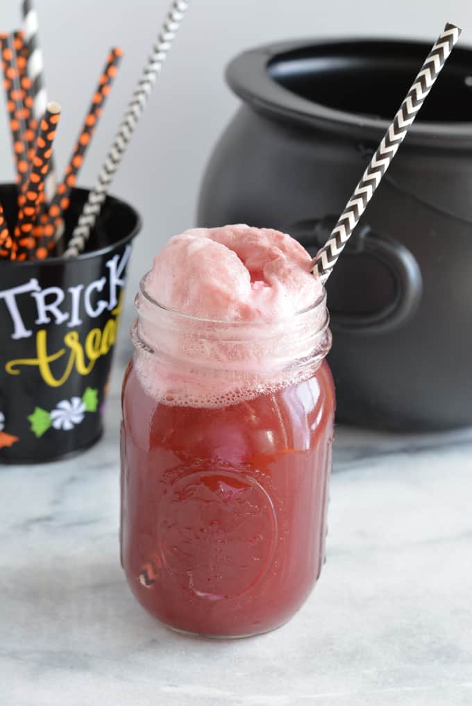 Purple People Eater Punch in a mason jar for Halloween.