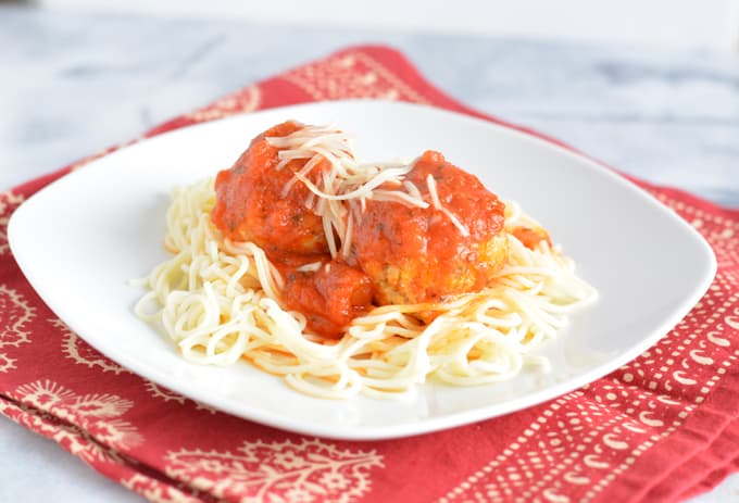 Turkey meatballs with spaghetti on a plate.