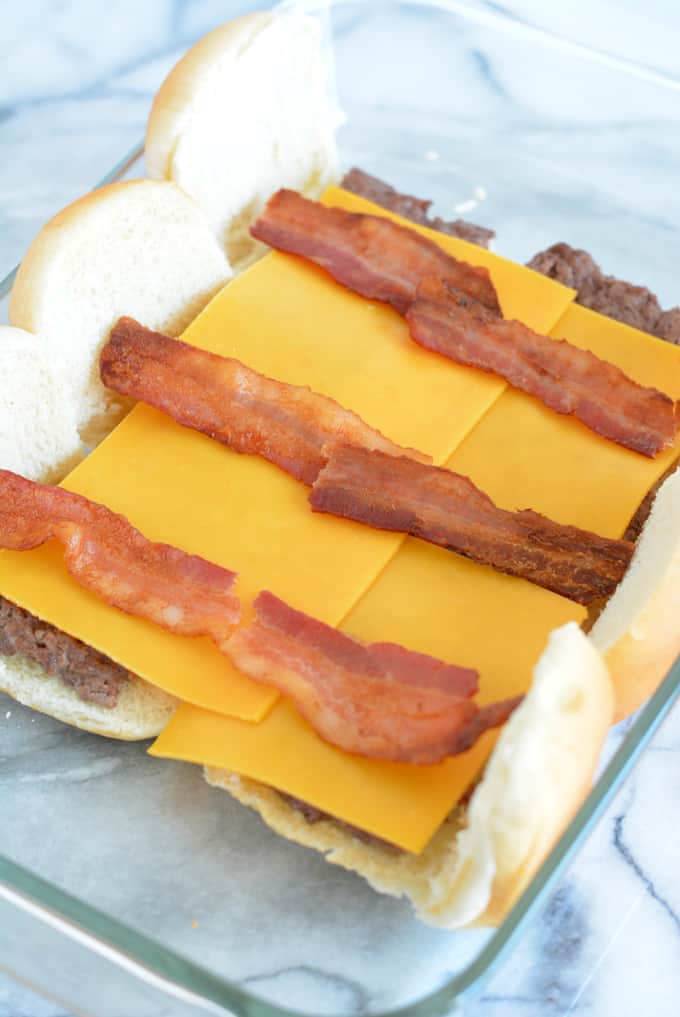 Bacon Cheddar Cheeseburger Sliders are the perfect game day snack. Baked in the oven there is no need to turn on your grill. Pepperidge farm sliders make game day easy. #sponsored #easyrecipes #gamedayrecipes #respectthebun #snacks #sliders #burgers