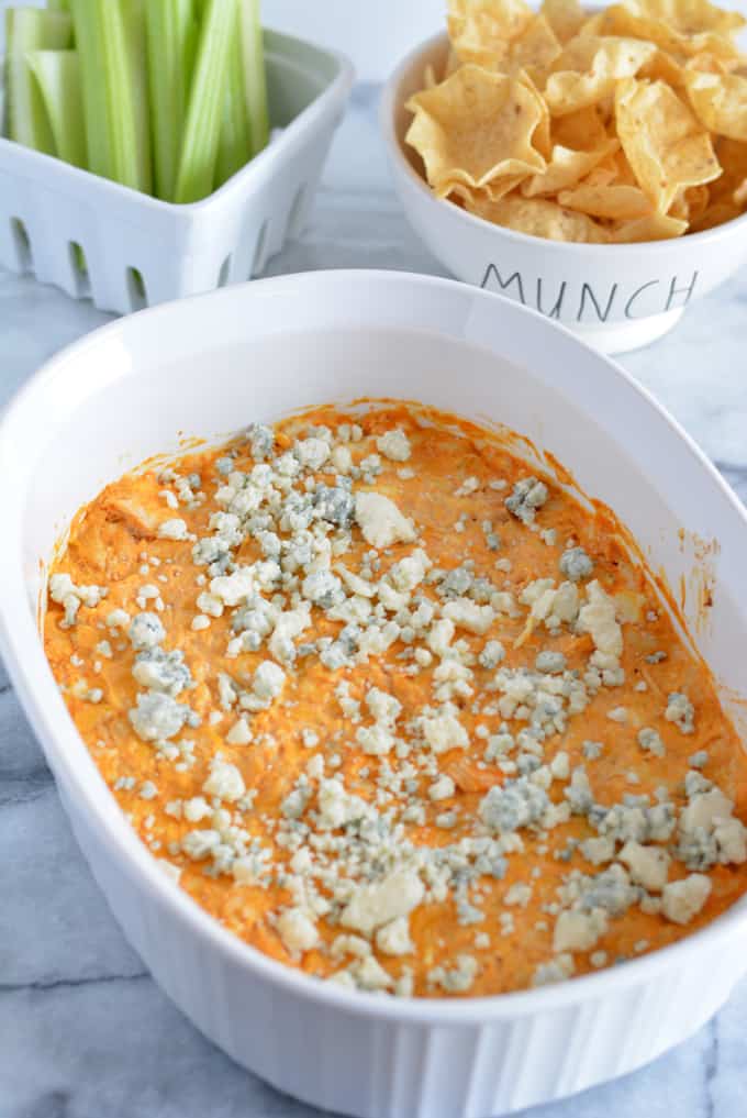 Baked Buffalo Chicken Dip with celery and chips
