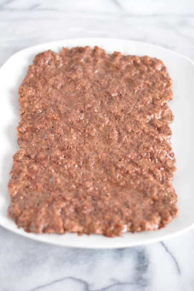 Cooked ground beef in a baking pan.