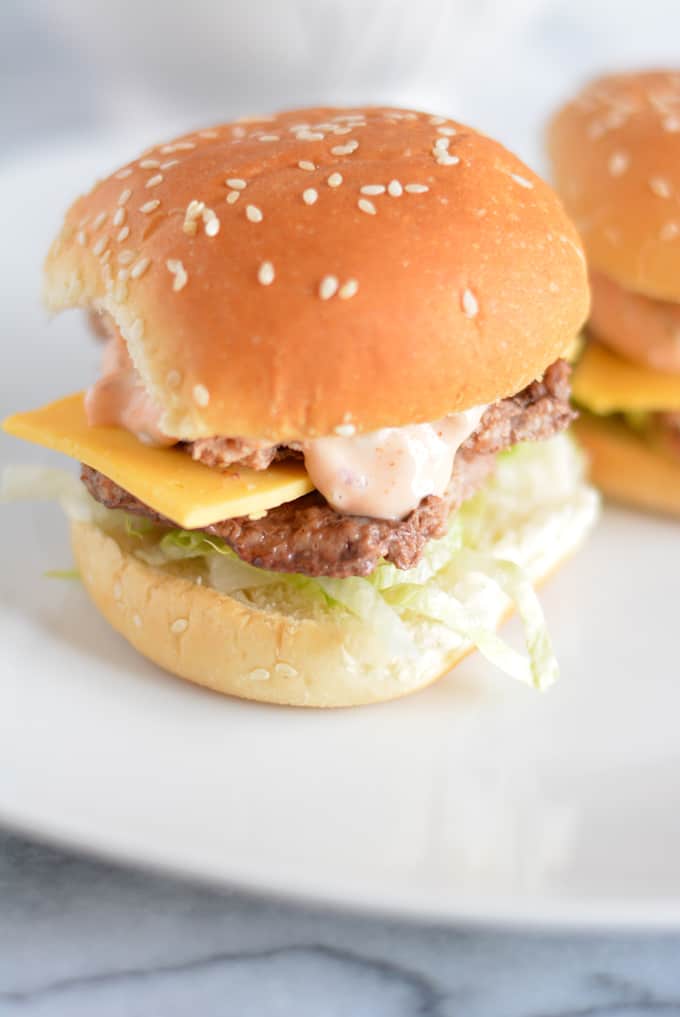 Mini big mac sliders on a plate.