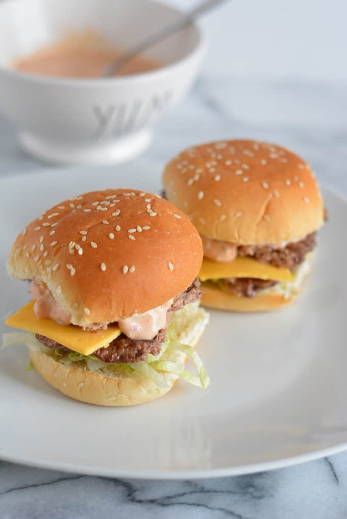 Mini Big Mac Sliders on a white plate.
