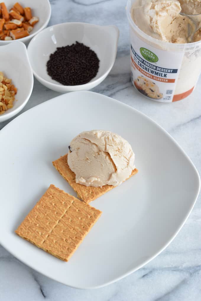 One scoop of low-calorie ice cream on top of a graham cracker.