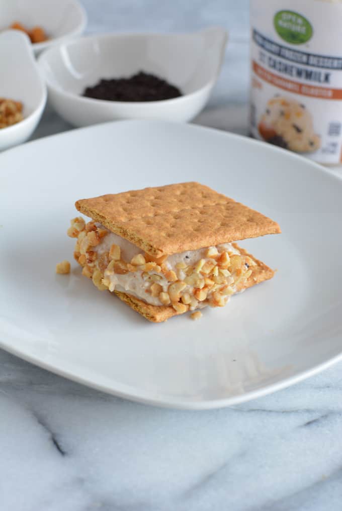 Low-calorie ice cream cookie sandwich on a white plate.