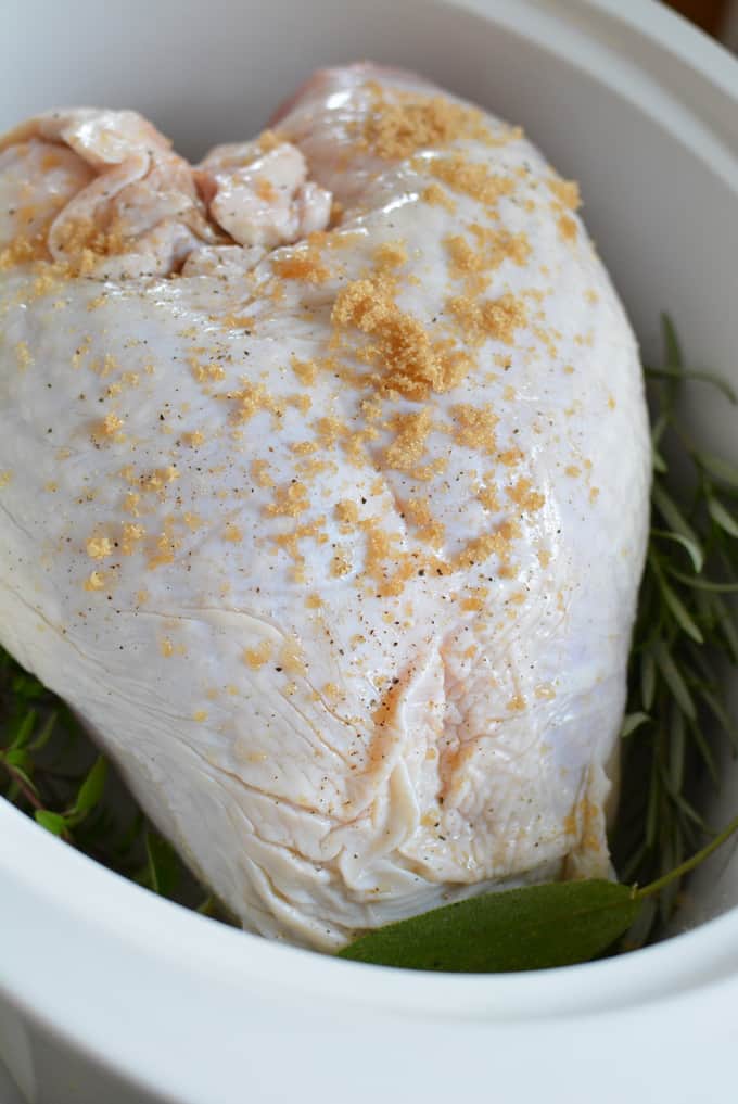 A bone-in turkey breast in a sow cooker.